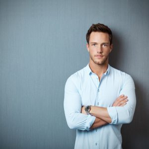 man with armed crossed